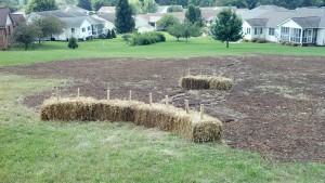 Top soil and stawbales.